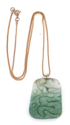 Lot 146 - A jade pendant and chain, the rectangular jade...