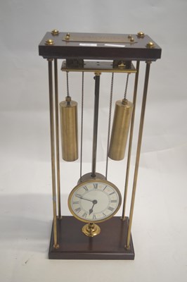 Lot 406 - A contemporary Rising Works clock set in a...