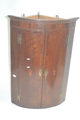 Lot 413 - A George III oak and mahogany cross banded bow...