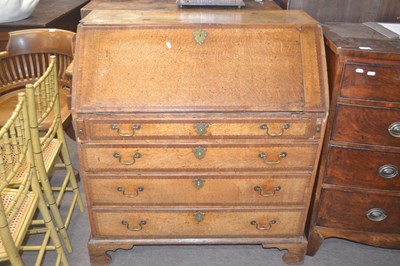 Lot 560 - A George III oak bureau of typical form with...
