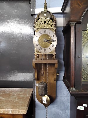 Lot 435 - A brass lantern clock likely of Victorian...
