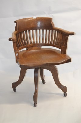 Lot 441 - An early 20th Century oak desk chair with bow...