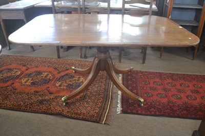 Lot 448 - A George III mahogany snap top dining table,...