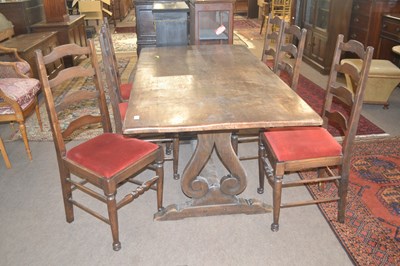 Lot 455 - A 20th Century oak refectory style dining...