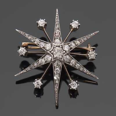 Lot 284 - A Victorian diamond star brooch/pendant, set...