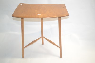 Lot 468 - A vintage Ercol light elm curved side table...