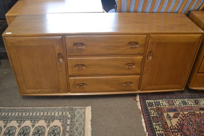 Lot 599 - An Ercol light elm low sideboard with two...