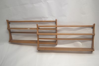 Lot 601 - A pair of light Ercol wall mounted shelves,...