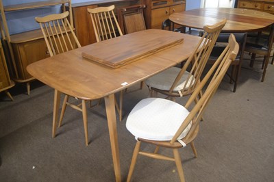 Lot 485 - An Ercol light elm extending dining table with...