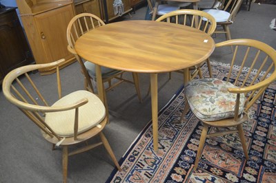 Lot 486 - An Ercol light elm oval kitchen table together...