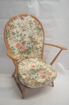 Lot 603 - An Ercol light elm low hard seated and stick...