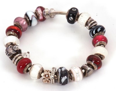 Lot 234 - A Lovelinks bracelet, the branded bangle with...