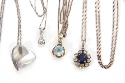 Lot 235 - Four necklaces: to include a 9ct CZ pendant...