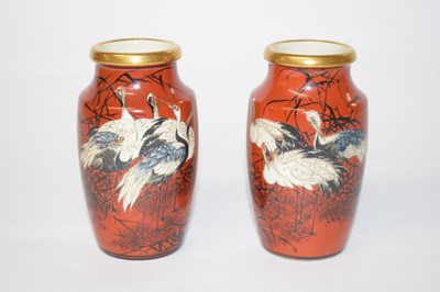 Lot 204 - A pair of Japanese Satsuma ware vases, the red...