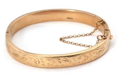 Lot 228 - A 9ct bangle, the hinged bangle with engraved...
