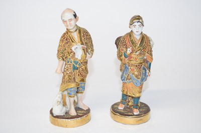 Lot 209 - Two Japanese porcelain figures of a lady and...