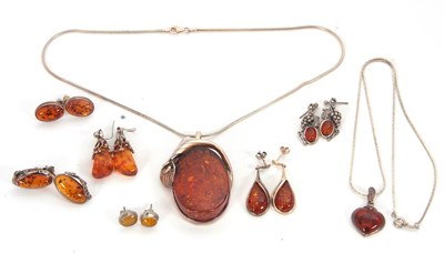 Lot 247 - A quantity of amber and silver jewellery, to...