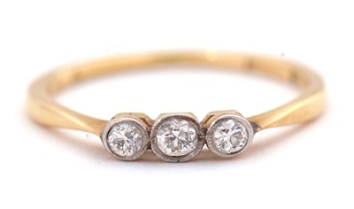 Lot 49 - A three stone diamond ring, the three old...