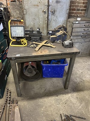 Lot 18 - A heavy duty metal work bench with sliding...