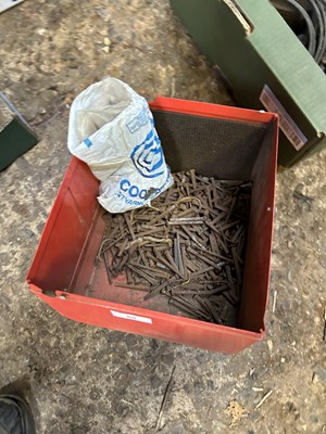 Lot 60 - Two metal storage tubs to include a quantity...