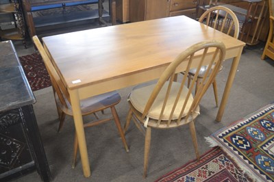 Lot 504 - An Ercol light elm rectangular kitchen table...