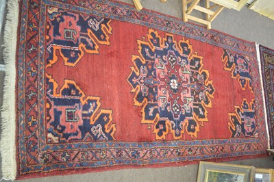 Lot 617 - A 20th Century Causasian wool rug decorated...