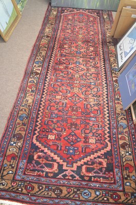 Lot 483 - 20th Century Causasian runner carpet decorated...