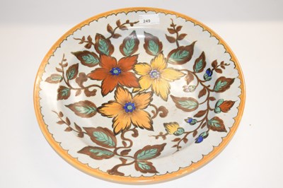 Lot 278 - A Gouda pottery plaque with floral design,...