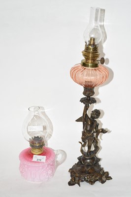 Lot 270 - A small hand held oil lamp together with a...