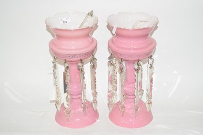 Lot 272 - A pair of pink glass table lustres, 37cm high