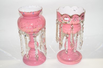 Lot 280 - Two pink glass table lustres, 36cm high