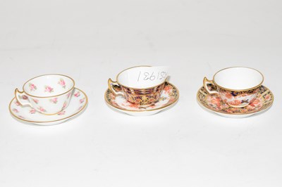 Lot 295 - A miniature Crown Derby cup and saucer...