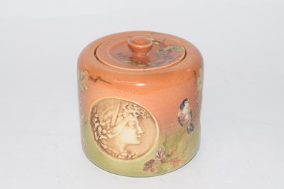 Lot 322 - An unusual Bretby pot and cover decorated with...