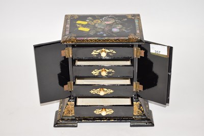 Lot 357 - A mother of pearl jewellery box with four...
