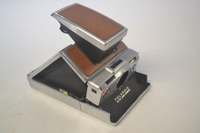 Lot 359 - A Poloroid SX70 land camera with brown body