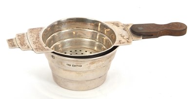 Lot 24 - An Art Deco silver tea strainer and bowl,...