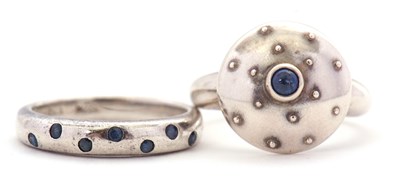 Lot 84 - Two silver and sapphire rings: one with domed...