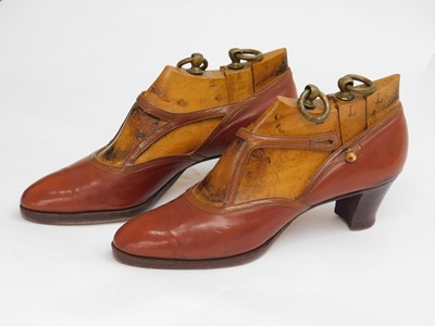 Lot 113 - A pair of lady's brown leather heeled shoes by...