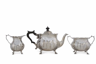 Lot 152 - A George V silver three piece tea service...