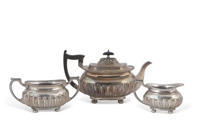 Lot 172 - An Edwardian silver three piece tea set of...