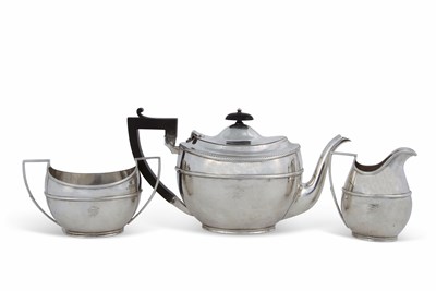 Lot 176 - A George V silver three piece tea service...