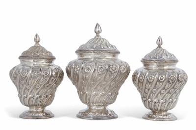 Lot 190 - A George II silver garniture of three lidded...