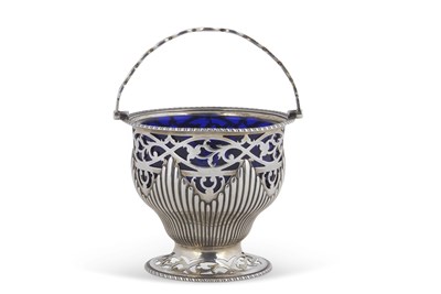 Lot 201 - A George III silver sugar basket with blue...