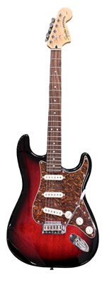 Lot 144 - A Fender Squier stratocaster electric guitar...