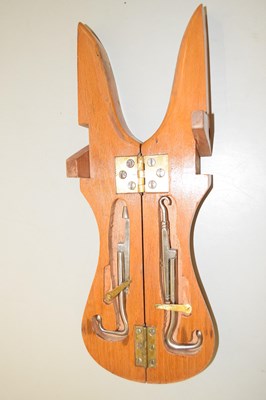 Lot 40 - A hardwood travelling boot jack with pulls