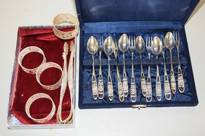 Lot 105 - A cased set of white metal and filigree spoons...
