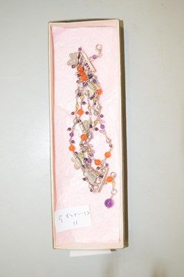 Lot 110 - A white metal butterfly decorated bracelet