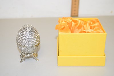 Lot 119 - A contemporary crystal encrusted egg shaped...