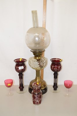 Lot 132 - A brass based oil lamp together with a pair of...