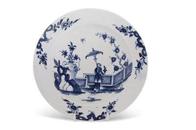 Lot 57 - A rare Lowestoft plate decorated in blue and...